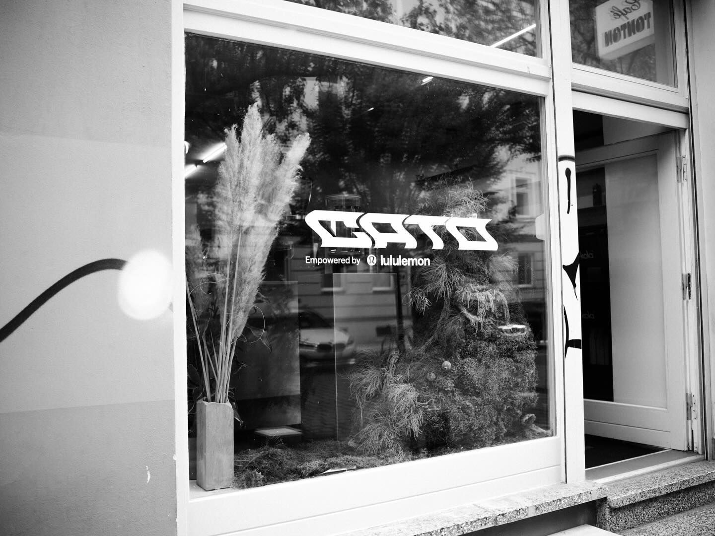 The café shop front with the CATO sign, empowered by lululemon