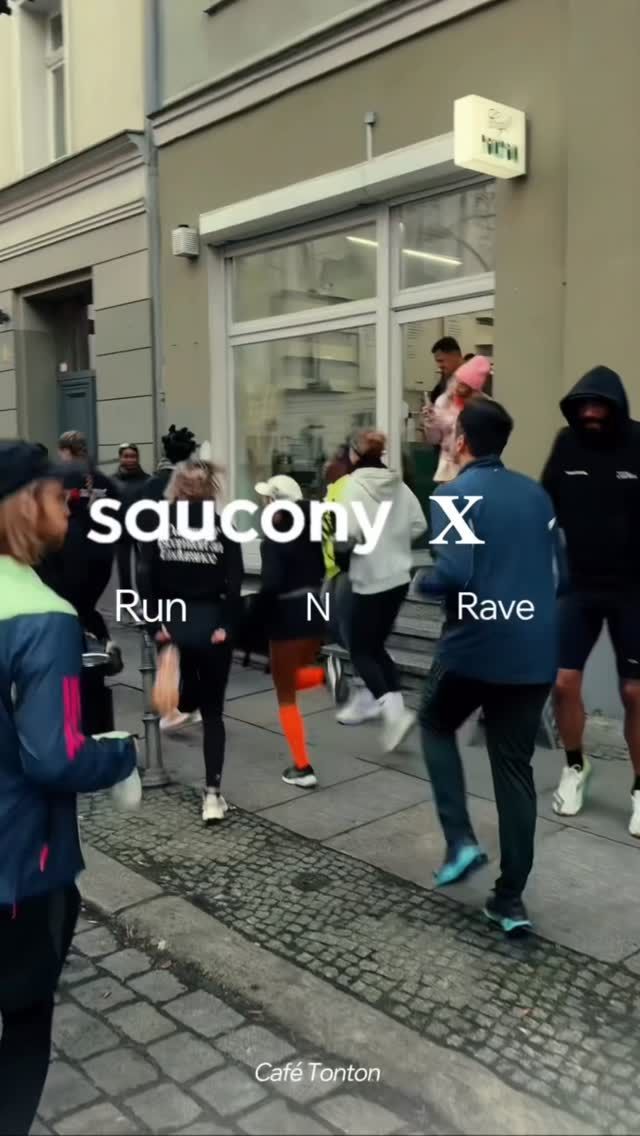 Runners in the street outside the café, with the words Saucony X Run N Rave